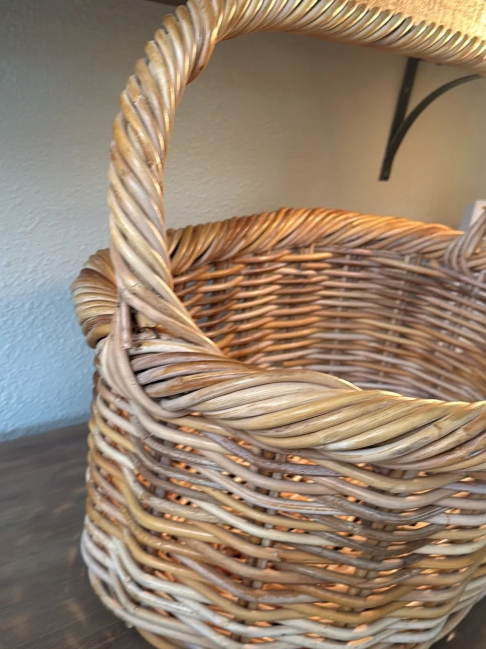 Woven Wicker Basket with Pink Crochet Throw